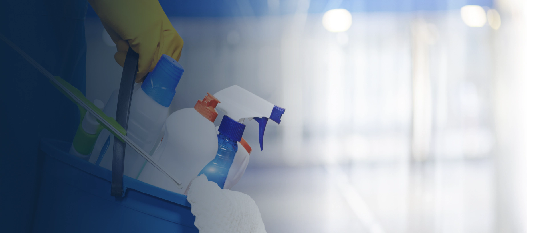 worker with set of cleaning supplies for residential service